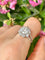 Bague 54 Bague marguerite en platine et diamants 58 Facettes 262