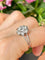 Bague 54 Bague marguerite en platine et diamants 58 Facettes 262