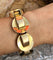 Bracelet Bracelet Tank cercles à volutes en or jaune 18k 58 Facettes 1