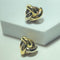 Boucles d'oreilles entrelacées en or jaune 18 carats 58 Facettes 260055