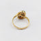 Bague 48 Bague tourbillon Toi et Moi en or 18k, émeraudes et diamants 58 Facettes A07221
