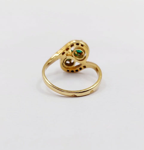 Bague 48 Bague tourbillon Toi et Moi en or 18k, émeraudes et diamants 58 Facettes A07221