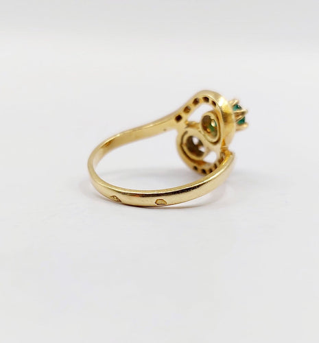 Bague 48 Bague tourbillon Toi et Moi en or 18k, émeraudes et diamants 58 Facettes A07221