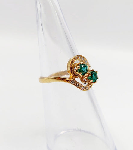 Bague 48 Bague tourbillon Toi et Moi en or 18k, émeraudes et diamants 58 Facettes A07221