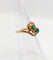 Bague 48 Bague tourbillon Toi et Moi en or 18k, émeraudes et diamants 58 Facettes A07221