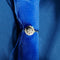 https://cdn.shopify.com/s/files/1/0943/8576/6747/files/bague-marguerite-or-blanc-diamants-fond-bleu.jpg?v=1792764035