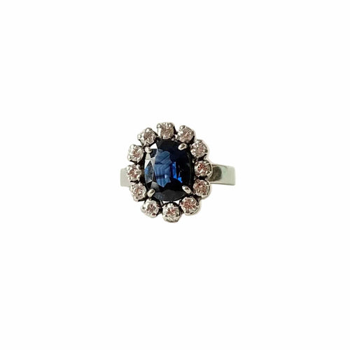 Bague 50 Bague marguerite en or blanc 18 carats, saphir et diamants, vers 1960 58 Facettes BIJ164