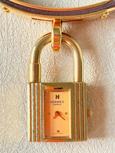 Montre Hermès Kelly - Montre cadenas en plaqué or et cuir 58 Facettes WC-2025-1806