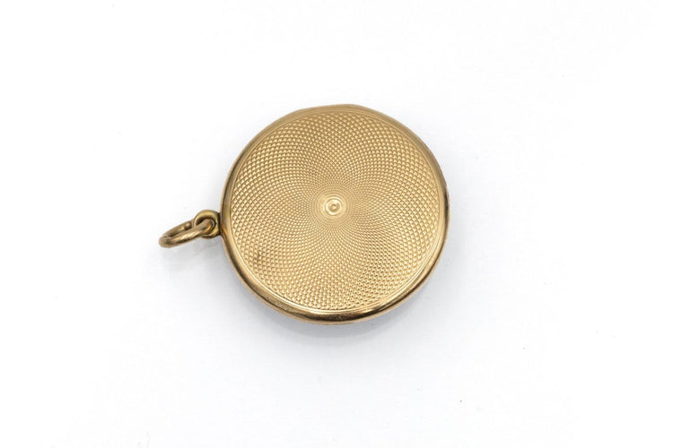 Pendentif Pendentif médaillon ancien en or jaune, émail guilloché et diamant 58 Facettes 12201