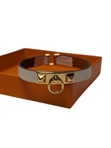 Bracelet Hermès Rivale Mini - Bracelet en plaqué or et cuir 58 Facettes 1217