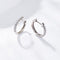 Boucles d'oreilles Embrace - Boucles d'oreilles créoles en or blanc et diamants 58 Facettes GER1356WG