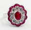 Bague 53.5 Bague marguerite vintage en or blanc, rubis et diamants 58 Facettes A07261
