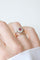 Bague 52.5 Bague marguerite ancienne en or rose, platine, rubis birman et diamants 58 Facettes