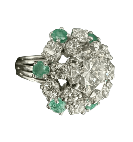 Bague 59 Bague marguerite en or blanc, diamants et émeraudes 58 Facettes Bague 04