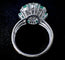 Bague 59 Bague marguerite en or blanc, diamants et émeraudes 58 Facettes Bague 04