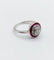 Bague 51.5 Bague cible Art déco en or blanc, platine, diamant et rubis synthétiques 58 Facettes A07317