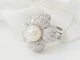 https://cdn.shopify.com/s/files/1/0750/3799/9372/files/l-aurore-bague-fleur-perle-diamants.jpg?v=1790846897