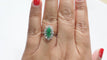 Bague 53 Bague marquise en or blanc, émeraude et diamants 58 Facettes 33052