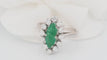 Bague 53 Bague marquise en or blanc, émeraude et diamants 58 Facettes 33052