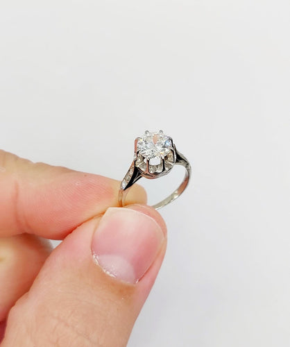 Bague 47 Bague solitaire Art déco en or blanc, platine et diamants 58 Facettes A07288
