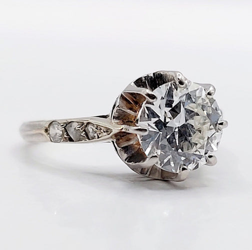 Bague 47 Bague solitaire Art déco en or blanc, platine et diamants 58 Facettes A07288