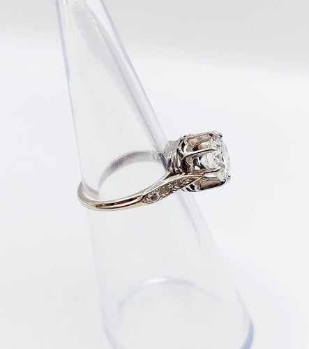 Bague 47 Bague solitaire Art déco en or blanc, platine et diamants 58 Facettes A07288