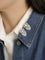 Boucles d'oreilles Broche double clip en or blanc et diamants 58 Facettes 1242.4