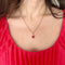 Pendentif cage perle de corail en or jaune_porté.jpeg