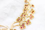 Parure florale en or jaune, rubis et diamants 58 Facettes 240164