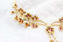 Parure florale en or jaune, rubis et diamants 58 Facettes 240164