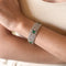 art-deco-platinum-diamond-and-emerald-ribbon-bracelet-on-hand-1400x1400.jpg