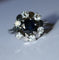 Bague 55 Bague marguerite en or blanc, saphir et diamants 58 Facettes 614