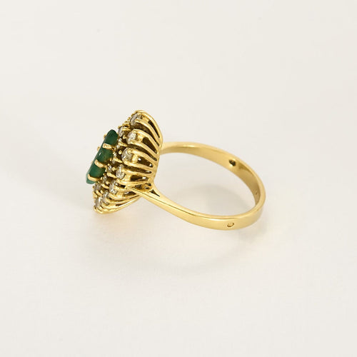 Bague 55 Bague navette en or jaune, émeraude et diamants 58 Facettes B260165