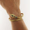 Bracelet Bracelet serpent semi-rigide en or jaune et blanc, diamants et saphirs 58 Facettes G3964