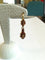 Boucles d'oreilles Boucles d'oreilles girandoles en or jaune et grenats 58 Facettes BO  001