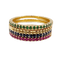 Lot de 4 demi-alliances en or 18k, saphirs, rubis et grenats tsavorites
