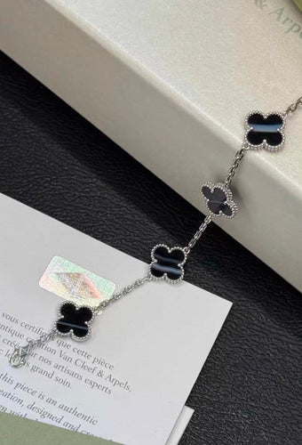 Bracelet Van Cleef & Arpels - Bracelet 5 motifs en or blanc et onyx 58 Facettes jnci107