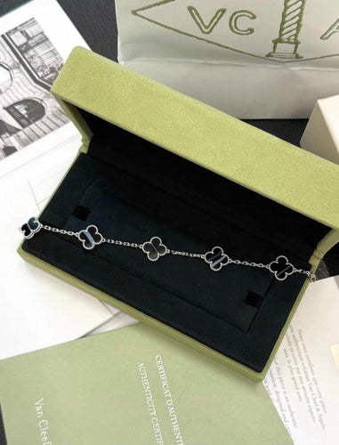 Bracelet Van Cleef & Arpels - Bracelet 5 motifs en or blanc et onyx 58 Facettes jnci107