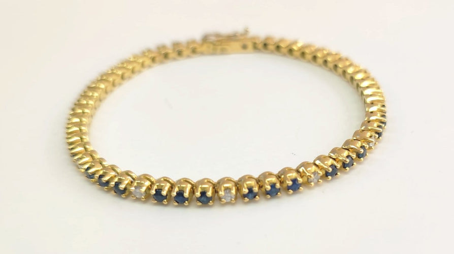 Bracelet Bracelet rivière en or jaune, saphirs et diamants 58 Facettes RIV-Saph-2335
