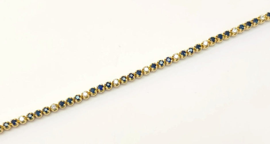 Bracelet Bracelet rivière en or jaune, saphirs et diamants 58 Facettes RIV-Saph-2335
