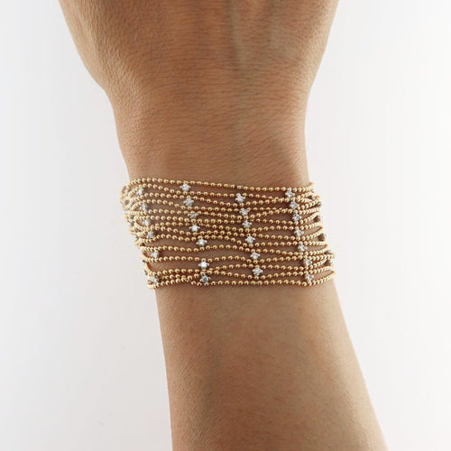 Bracelet Bracelet souple en or jaune et blanc avec diamants 58 Facettes G3971
