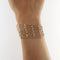 Bracelet Bracelet souple en or jaune et blanc avec diamants 58 Facettes G3971