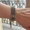 Bracelet Bracelet manchette tissé en or gris 58 Facettes REF24086-249