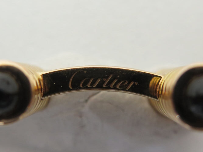Boutons de manchette Cartier Décors Ressorts - Boutons de manchette en or rose et onyx 58 Facettes 274667