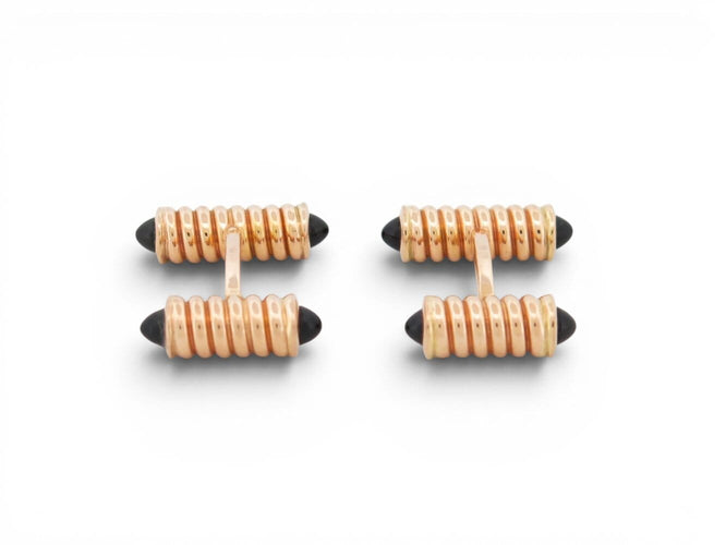 Boutons de manchette Cartier Décors Ressorts - Boutons de manchette en or rose et onyx 58 Facettes 274667