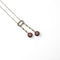 Collier Collier négligé - Collier en or gris et or jaune 18K, diamants et rubis 58 Facettes REF24087-250