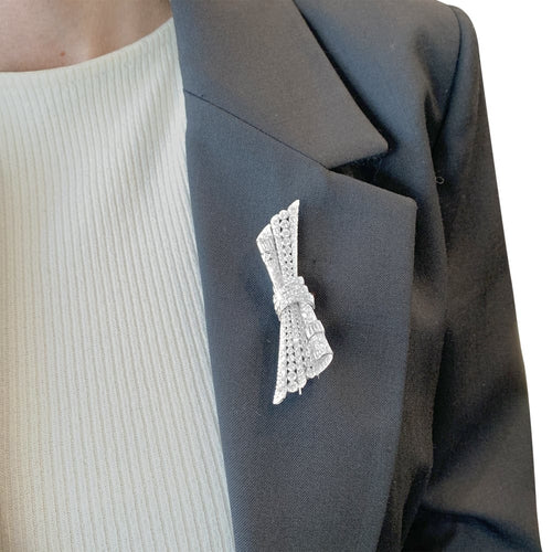 Boucles d'oreilles Broche double-clip Nœud en or blanc, platine et diamants 58 Facettes 35673