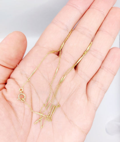 Collier Collier chaîne vintage en or 18K à mailles forçat 58 Facettes A07405