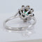 Bague 53 Bague marguerite en or blanc, émeraude et diamants 58 Facettes R007