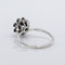 Bague 53 Bague marguerite en or blanc, émeraude et diamants 58 Facettes R007